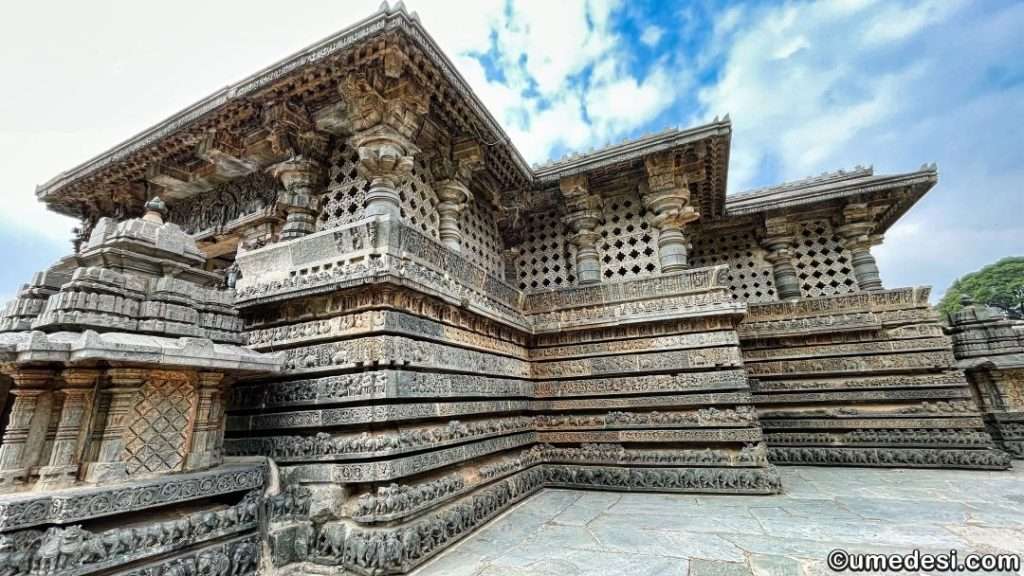 Side view of the Hoysaleswara Temple displaying its layered architecture and intricate stone carvings.