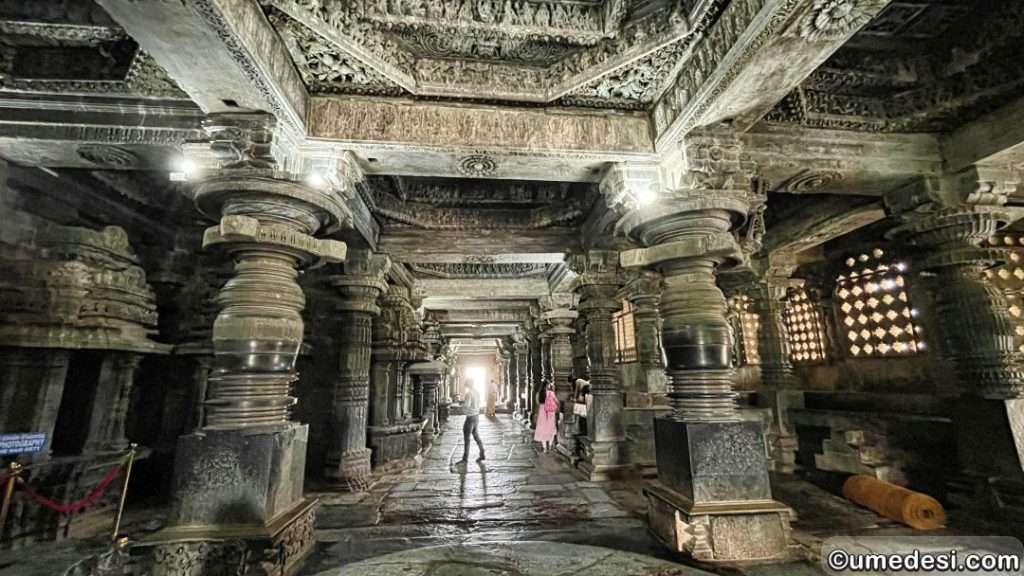 Another angle of the temple hall at Hoysaleswara Temple, capturing its symmetrical pillars and carvings.