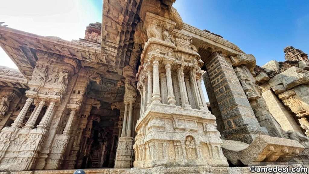 Pillared mandapa with intricate carvings in the Vijaya Vittala Temple complex, Hampi.