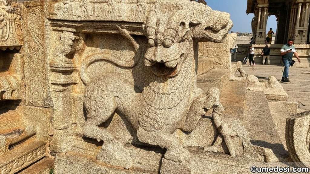 Stone sculpture of a lion on the steps of Vijaya Vittala Temple, Hampi.