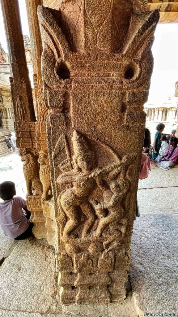 Intricately carved pillar with deity depiction at Vijaya Vittala Temple, Hampi.